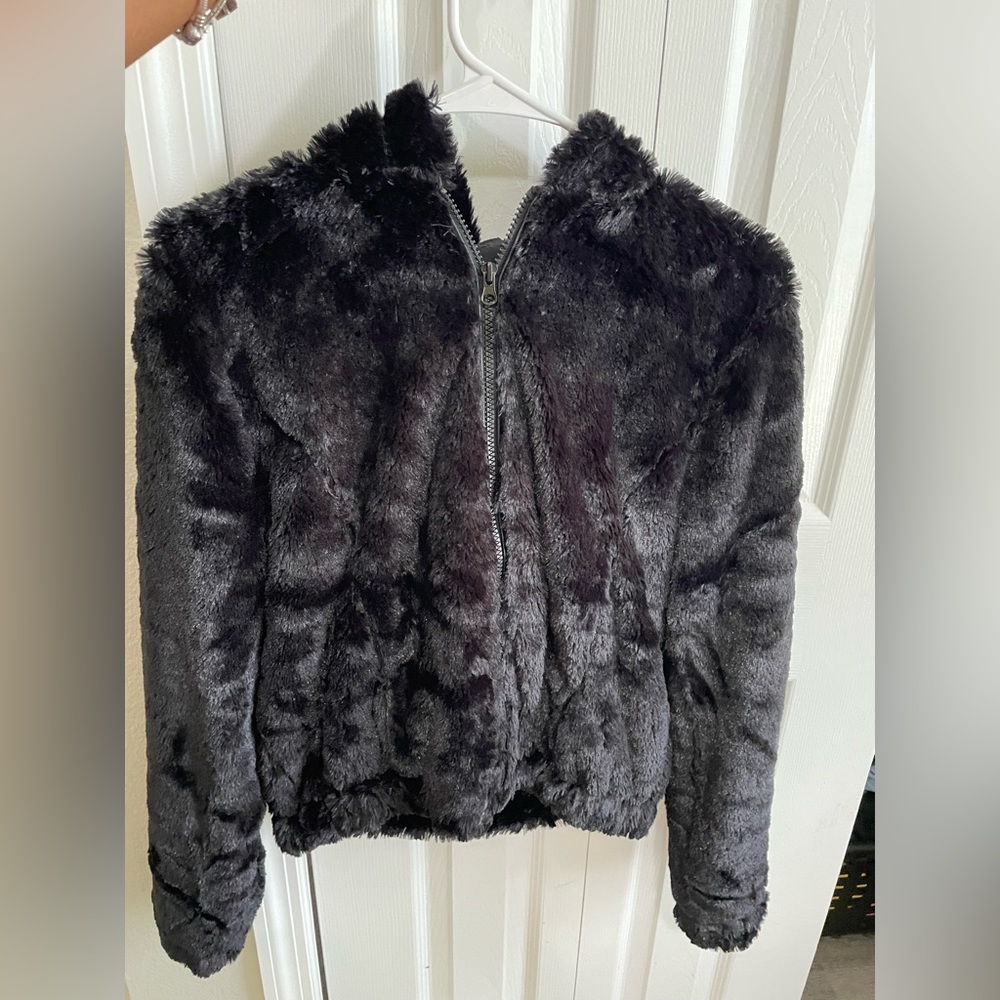 Black furry jacket with hood. Worn one.